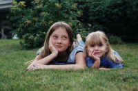 Brit and Brenna laying on grass.jpg (74727 bytes)